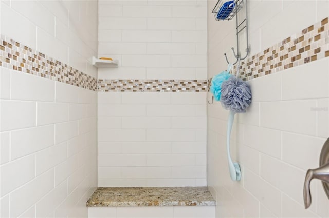 bathroom featuring tiled shower