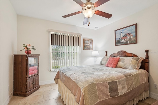 bedroom with ceiling fan and light tile patterned flooring