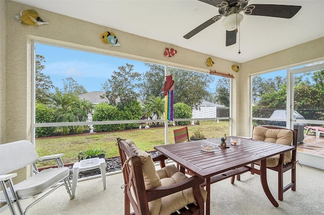 sunroom with ceiling fan and a healthy amount of sunlight