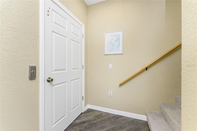 stairway featuring hardwood / wood-style floors