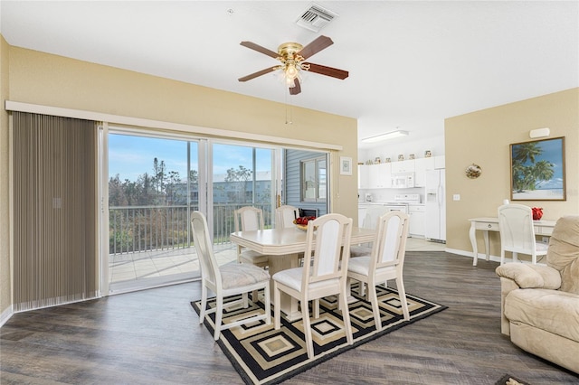 dining area featuring dark hardwood / wood-style floors and ceiling fan