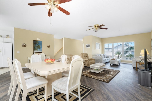 dining space featuring dark wood-type flooring and ceiling fan