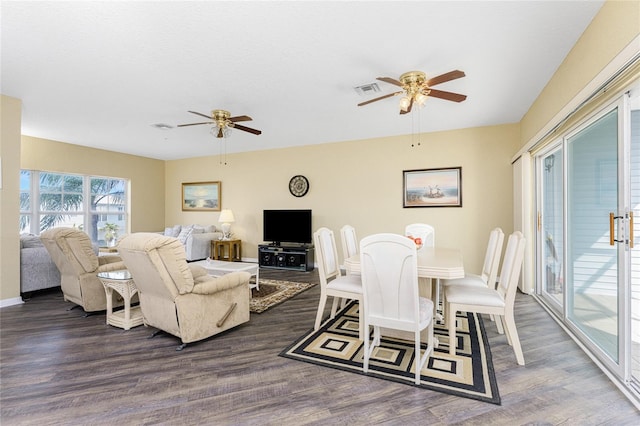 dining area featuring ceiling fan and dark hardwood / wood-style flooring