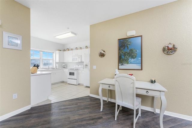 office with light hardwood / wood-style flooring