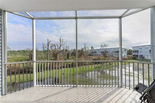 unfurnished sunroom featuring a wealth of natural light