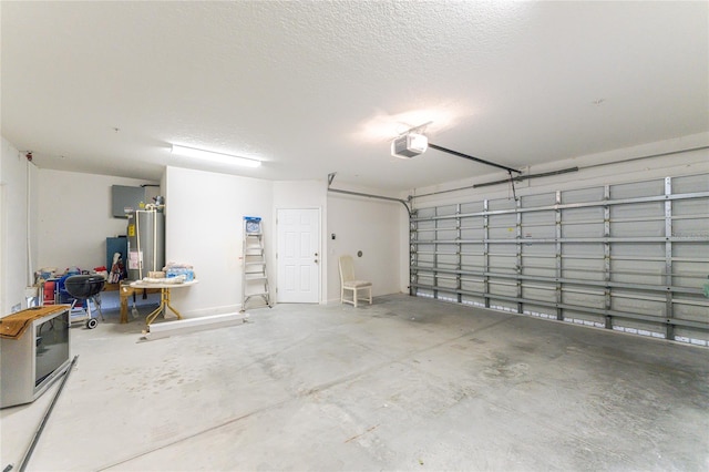 garage featuring water heater and a garage door opener