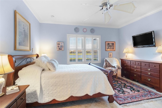 bedroom featuring ceiling fan, ornamental molding, and tile patterned floors