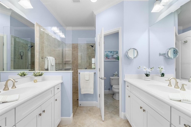 bathroom featuring crown molding, vanity, toilet, and a tile shower