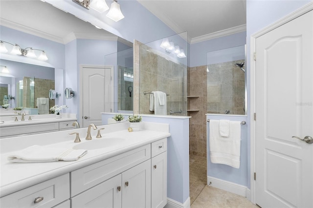 bathroom with vanity, ornamental molding, tile patterned floors, and tiled shower