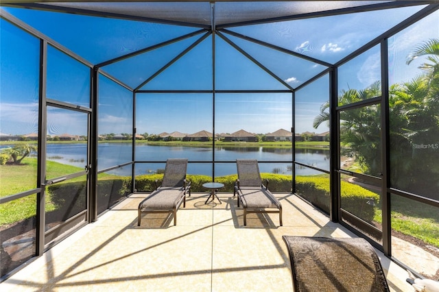 unfurnished sunroom with a water view