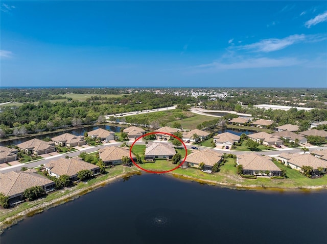 drone / aerial view with a water view