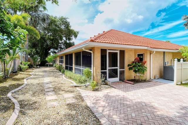 back of property featuring a sunroom