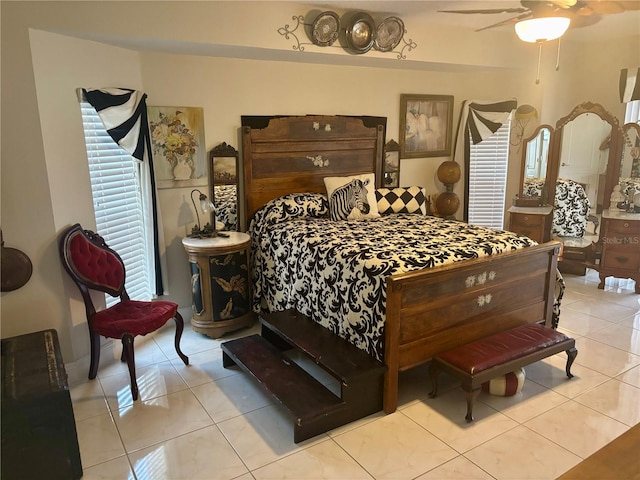 bedroom with light tile patterned flooring and ceiling fan