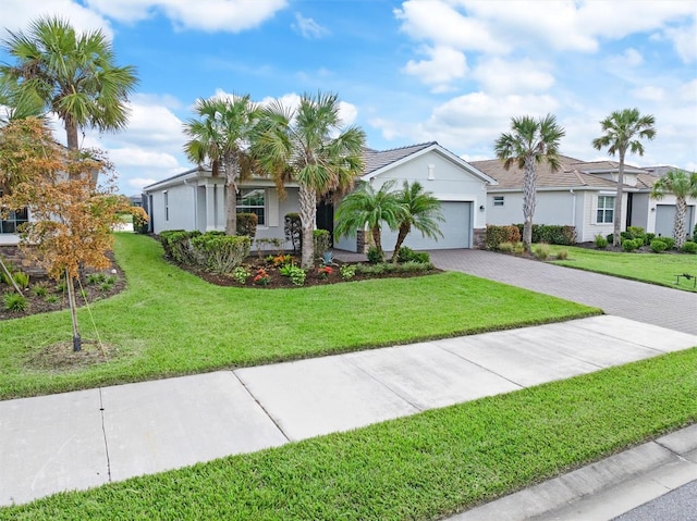 single story home featuring a front yard and a garage