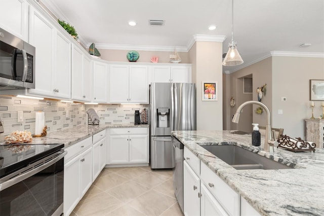 kitchen featuring sink, backsplash, stainless steel appliances, white cabinets, and crown molding