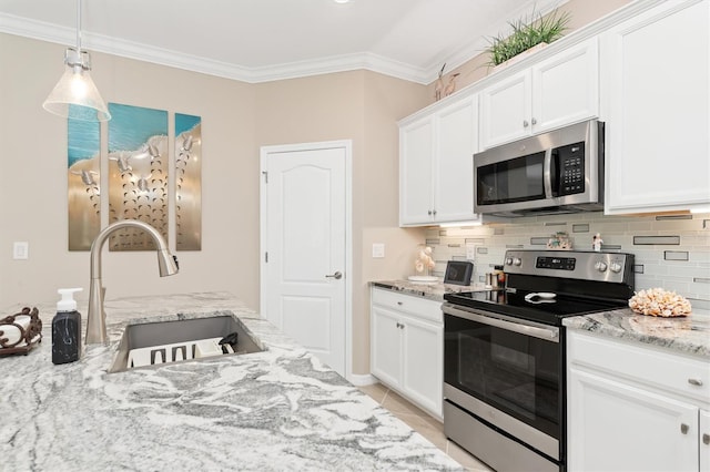 kitchen featuring sink, white cabinets, appliances with stainless steel finishes, light stone counters, and tasteful backsplash