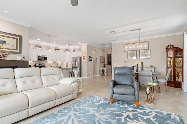 tiled living room with crown molding and a notable chandelier