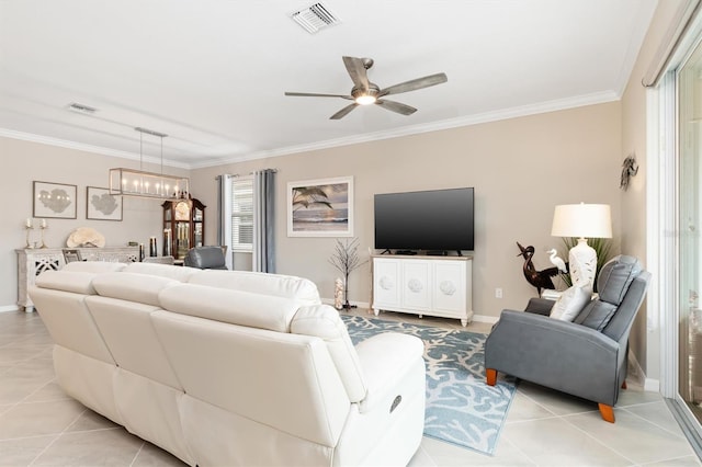 tiled living room with ornamental molding and ceiling fan with notable chandelier