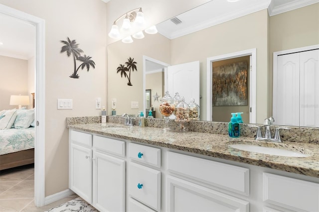 bathroom featuring vanity, crown molding, and tile patterned flooring