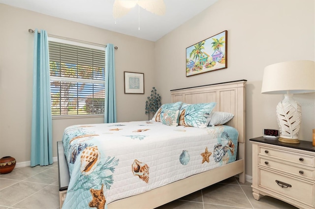 tiled bedroom with ceiling fan