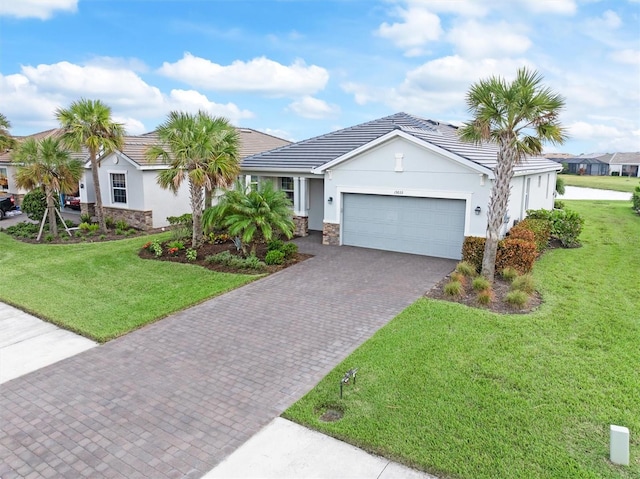 single story home with a front yard and a garage