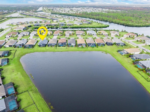 birds eye view of property with a water view