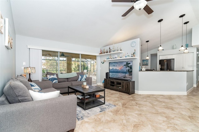 living room with ceiling fan and vaulted ceiling