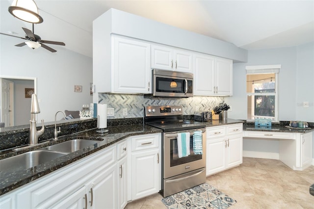 kitchen with stainless steel appliances, sink, and white cabinets