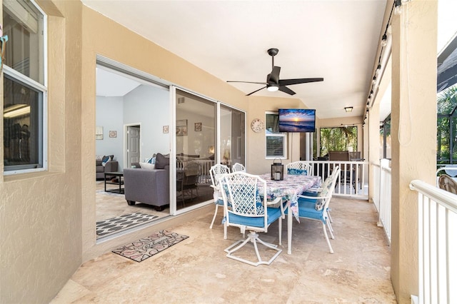 view of patio featuring ceiling fan