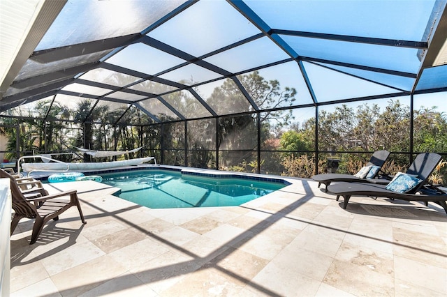 view of pool featuring a lanai and a patio area