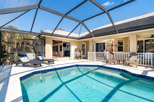 view of pool featuring a patio and glass enclosure