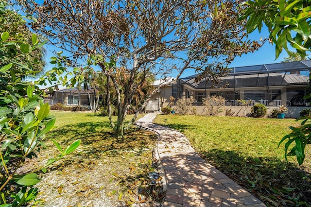 view of yard featuring glass enclosure