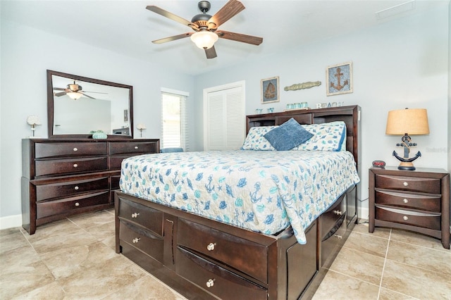 bedroom featuring light tile patterned floors and ceiling fan