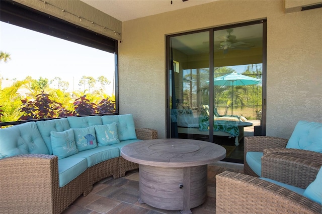 balcony featuring an outdoor living space and a patio area