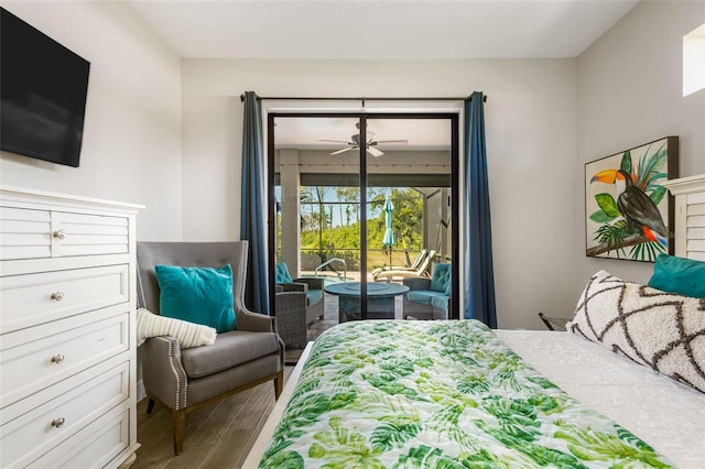 bedroom with access to outside and hardwood / wood-style floors