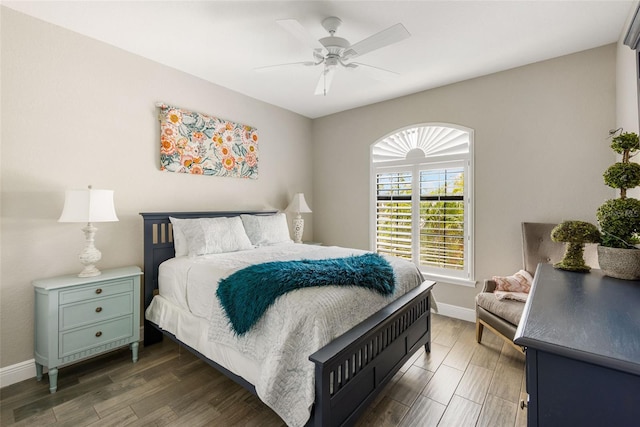 bedroom with dark wood-type flooring and ceiling fan