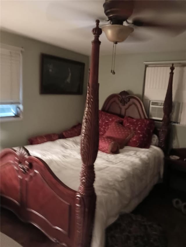 bedroom featuring cooling unit and ceiling fan