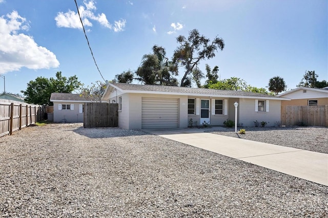 single story home with a garage