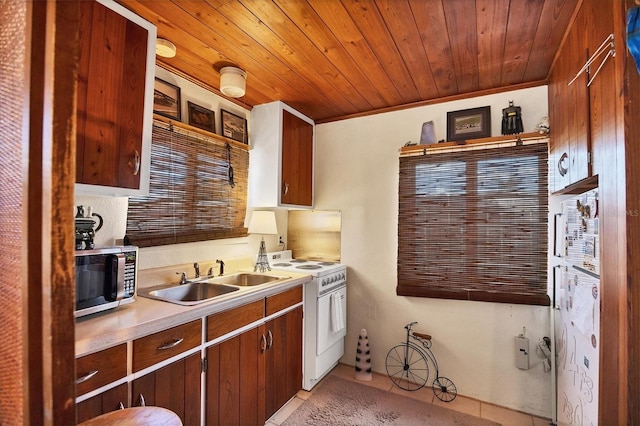 kitchen featuring gas range gas stove, wooden ceiling, ornamental molding, sink, and light tile patterned flooring