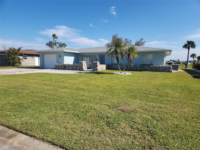 ranch-style house featuring a front lawn and a garage