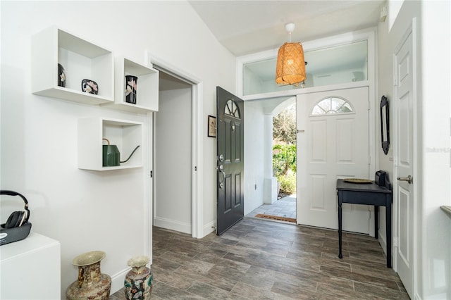 foyer entrance with dark hardwood / wood-style floors