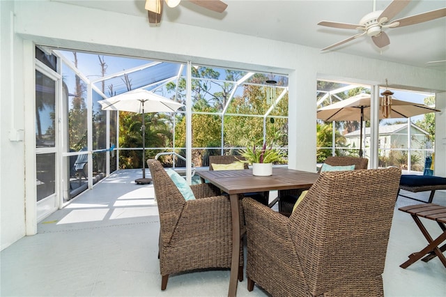 sunroom / solarium featuring ceiling fan