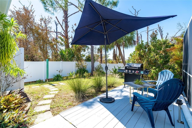 wooden terrace with area for grilling