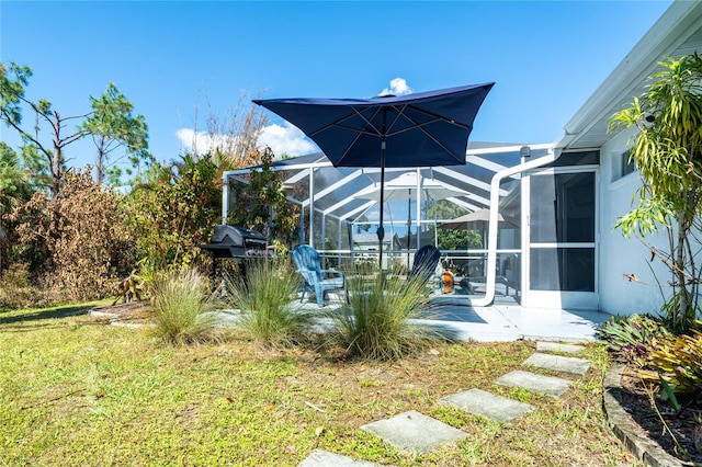 view of yard with a patio area and a lanai