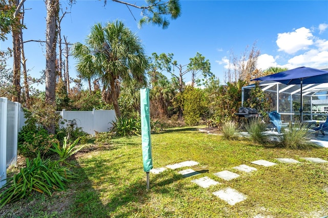 view of yard featuring a lanai