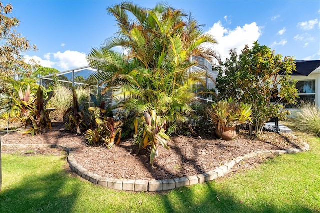 view of yard with glass enclosure