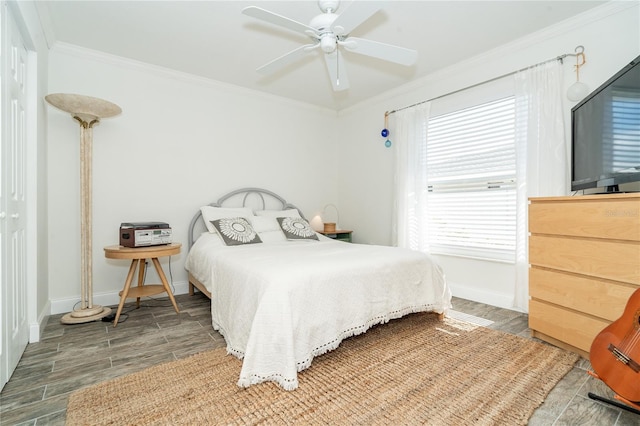 bedroom featuring dark hardwood / wood-style flooring, crown molding, and ceiling fan