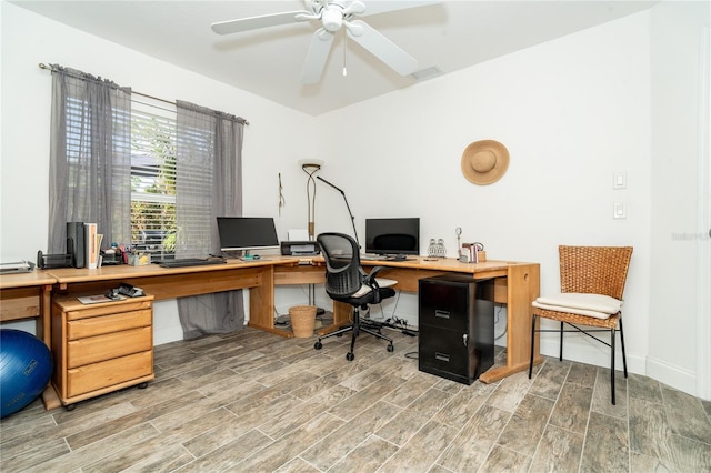 office with ceiling fan and hardwood / wood-style flooring