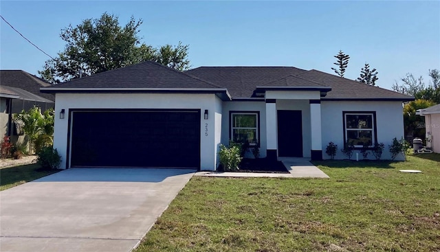 view of front facade with a garage, a shingled roof, concrete driveway, a front lawn, and stucco siding