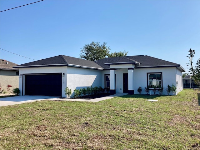 view of front of house with a garage, a front yard, concrete driveway, and stucco siding